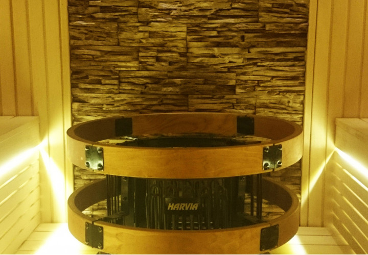 Sauna with Glass Front and Stone Wall
