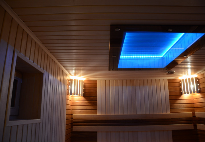 Sauna with Wood-Burning Heater and Glass Ceiling