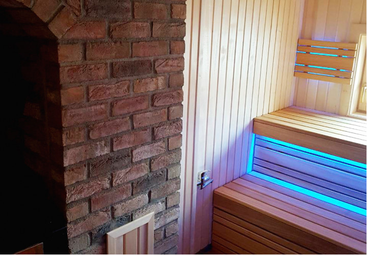Sauna with Heat-Storing Heater and Window