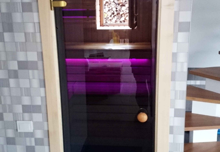 Sauna with Contrasting Interior and Heat-Storing Heater