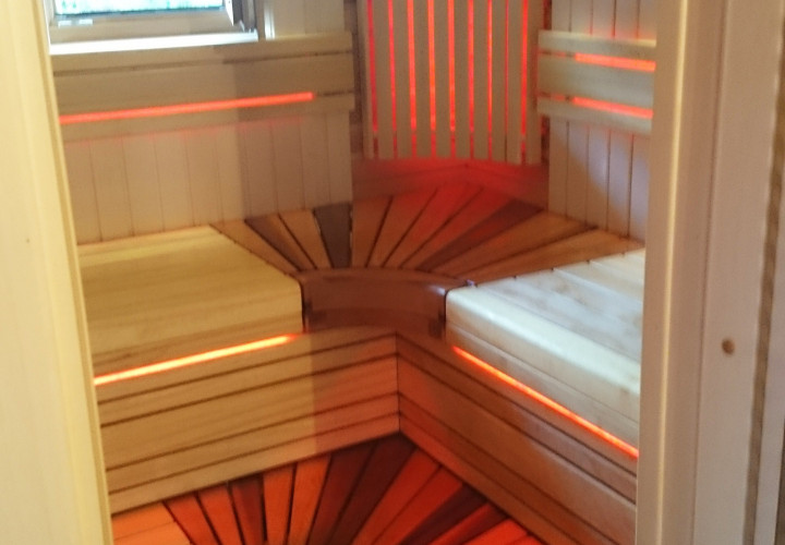Sauna with a Closed-Type Heater and a Window