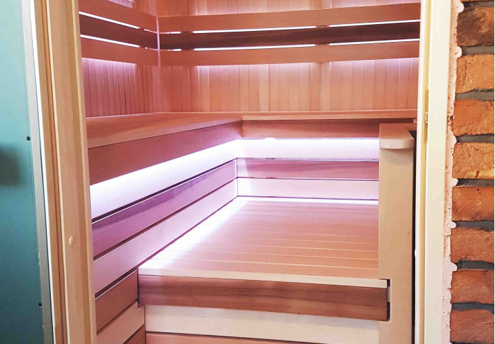 Sauna with a Wood-Burning Heater and External Firebox