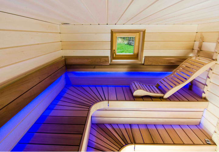 Sauna with Heat-Storing Heater and External Firebox