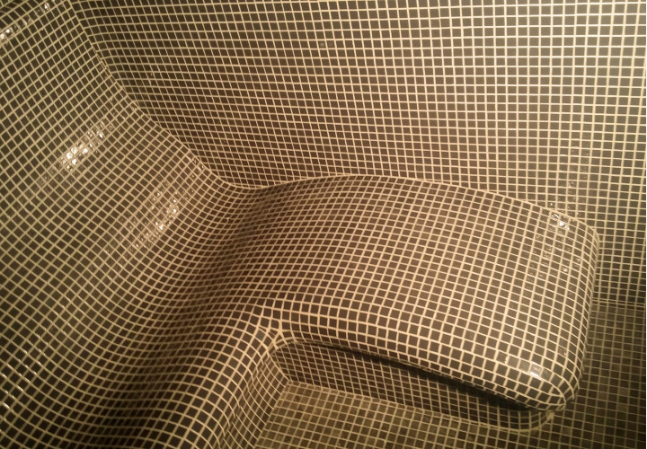 Steam room with sitting and semi-reclining area