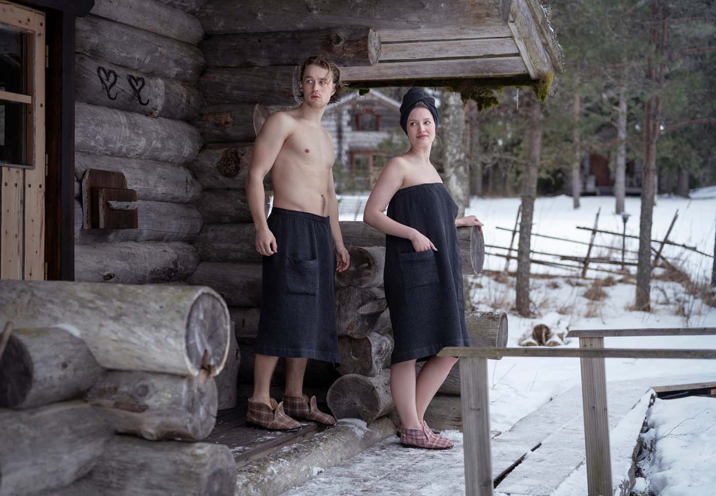 Man and woman wearing sauna clothing