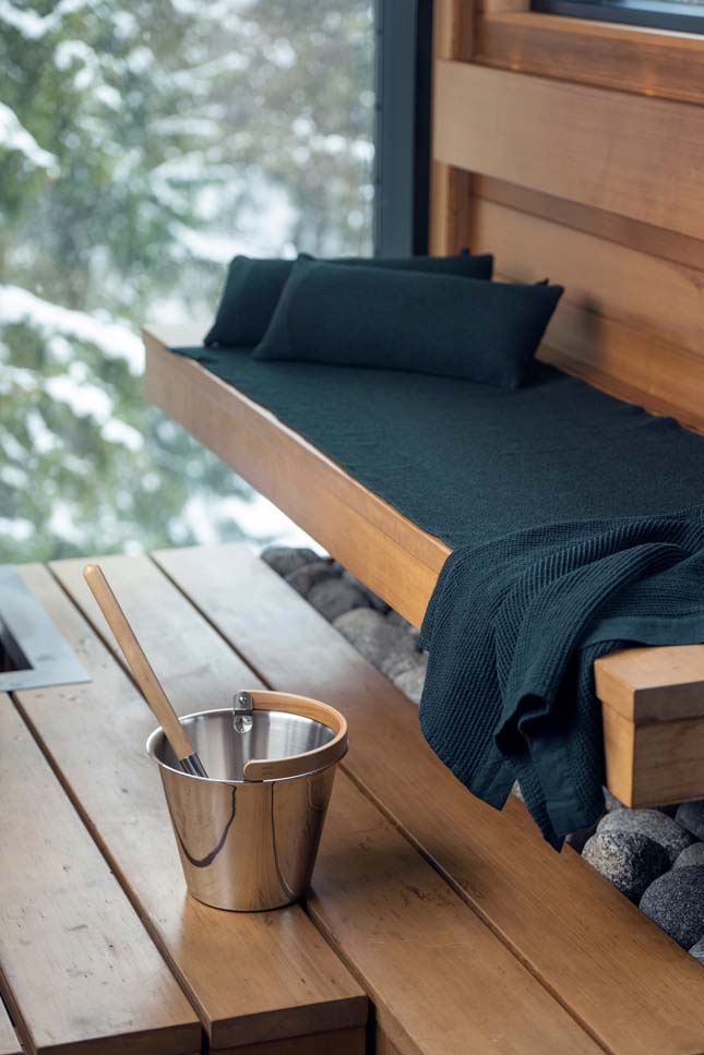 Sauna benches with towels and cushions