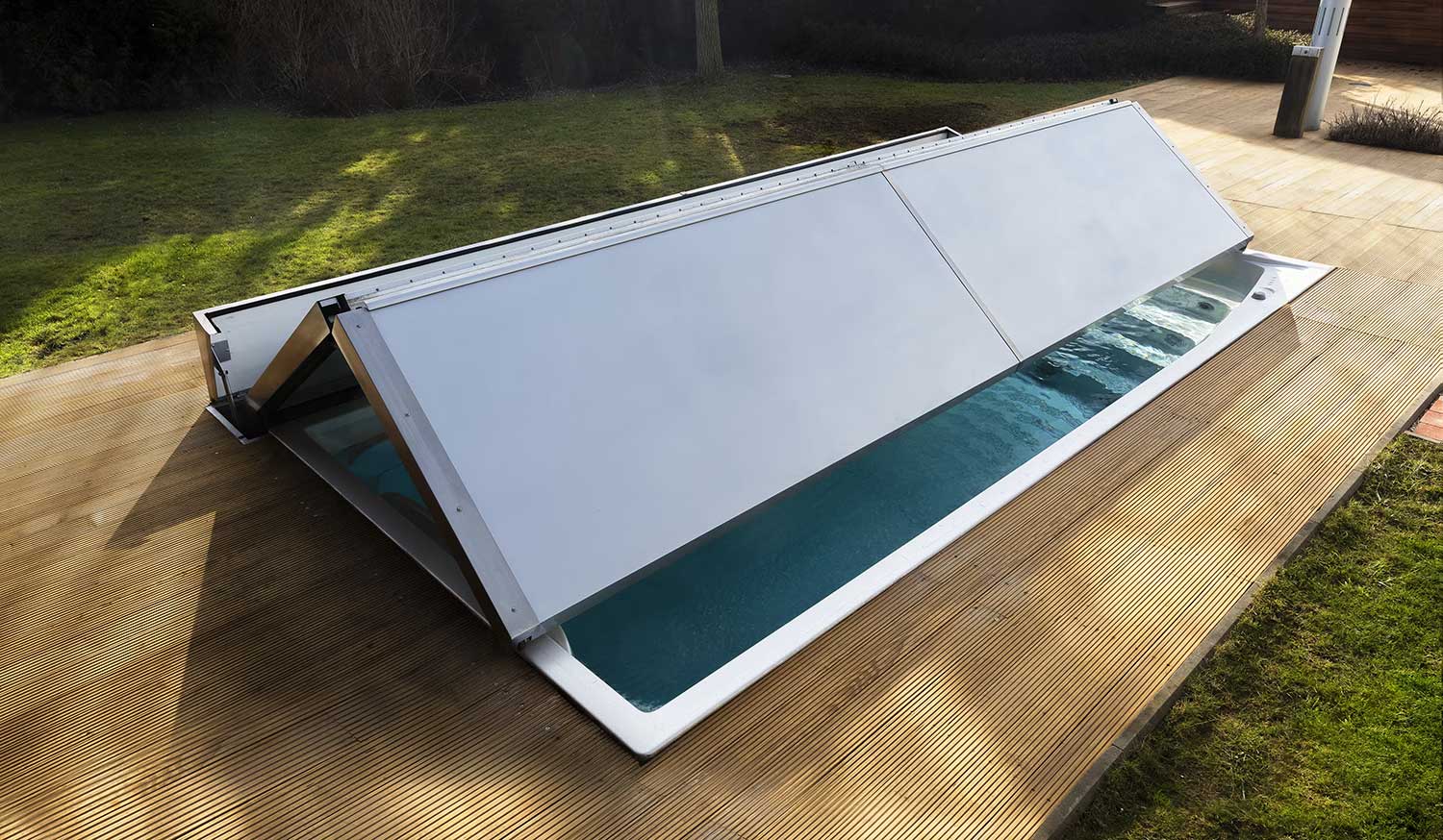 Outdoor USSPA swim spa with a partially opened segmented cover