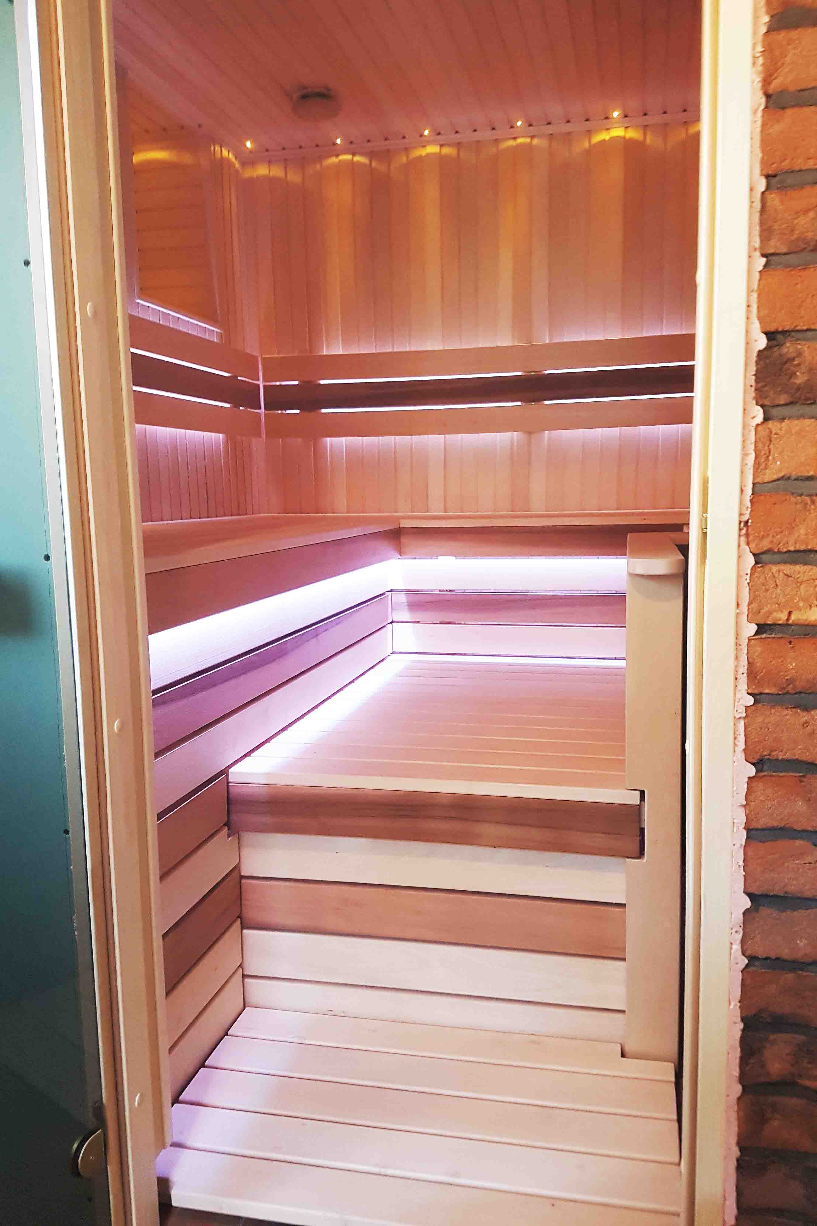 Sauna with a Wood-Burning Heater and External Firebox
